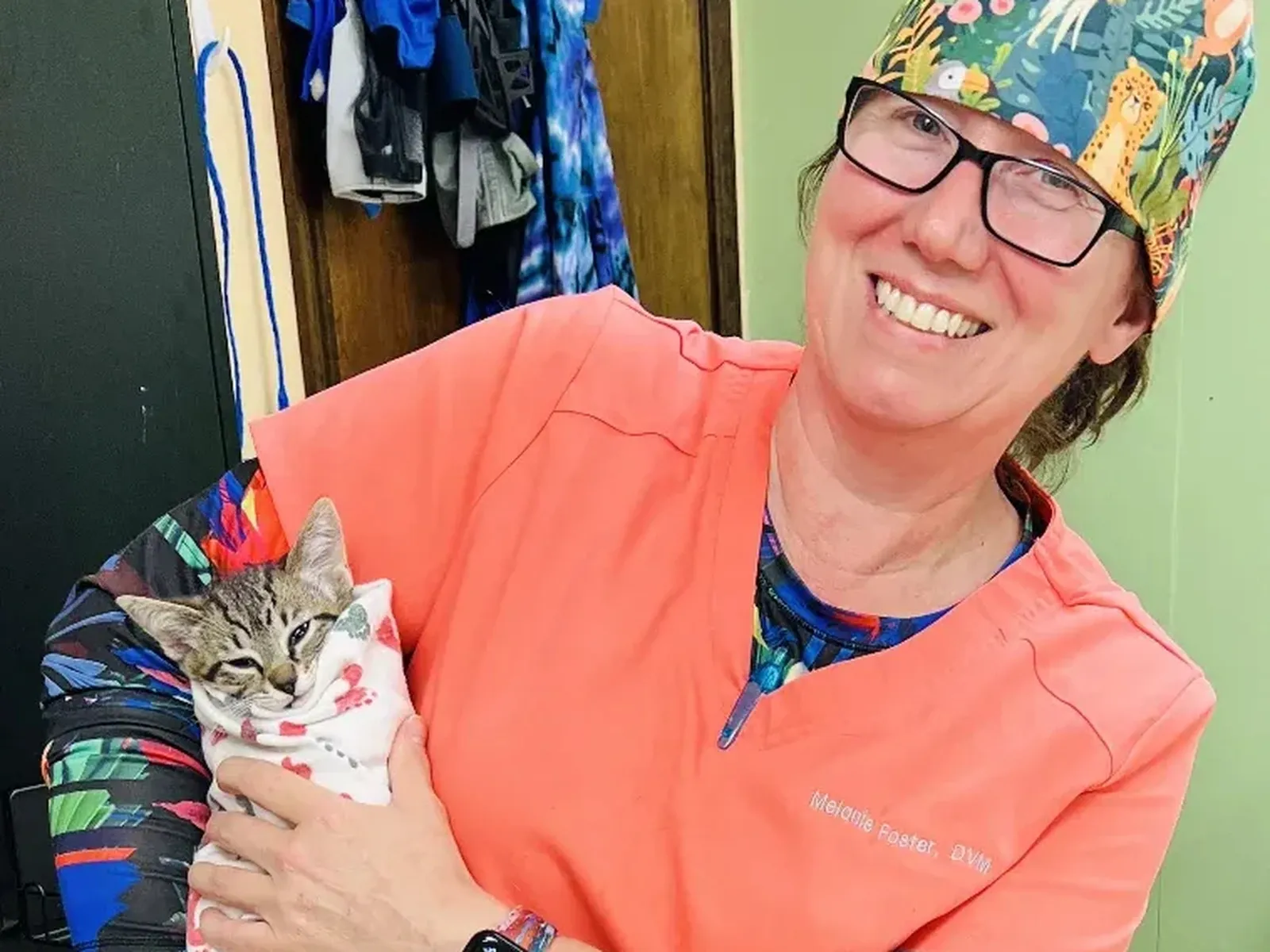 Spay Oklahoma veterinary team member holding a cat